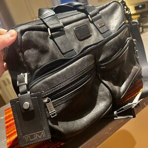 Genuine Leather Tumi briefcase.